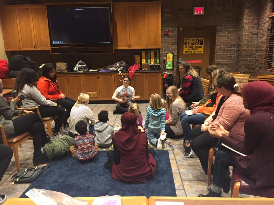 A picture of Kristen Smigielski reading to students at Global Book Hour