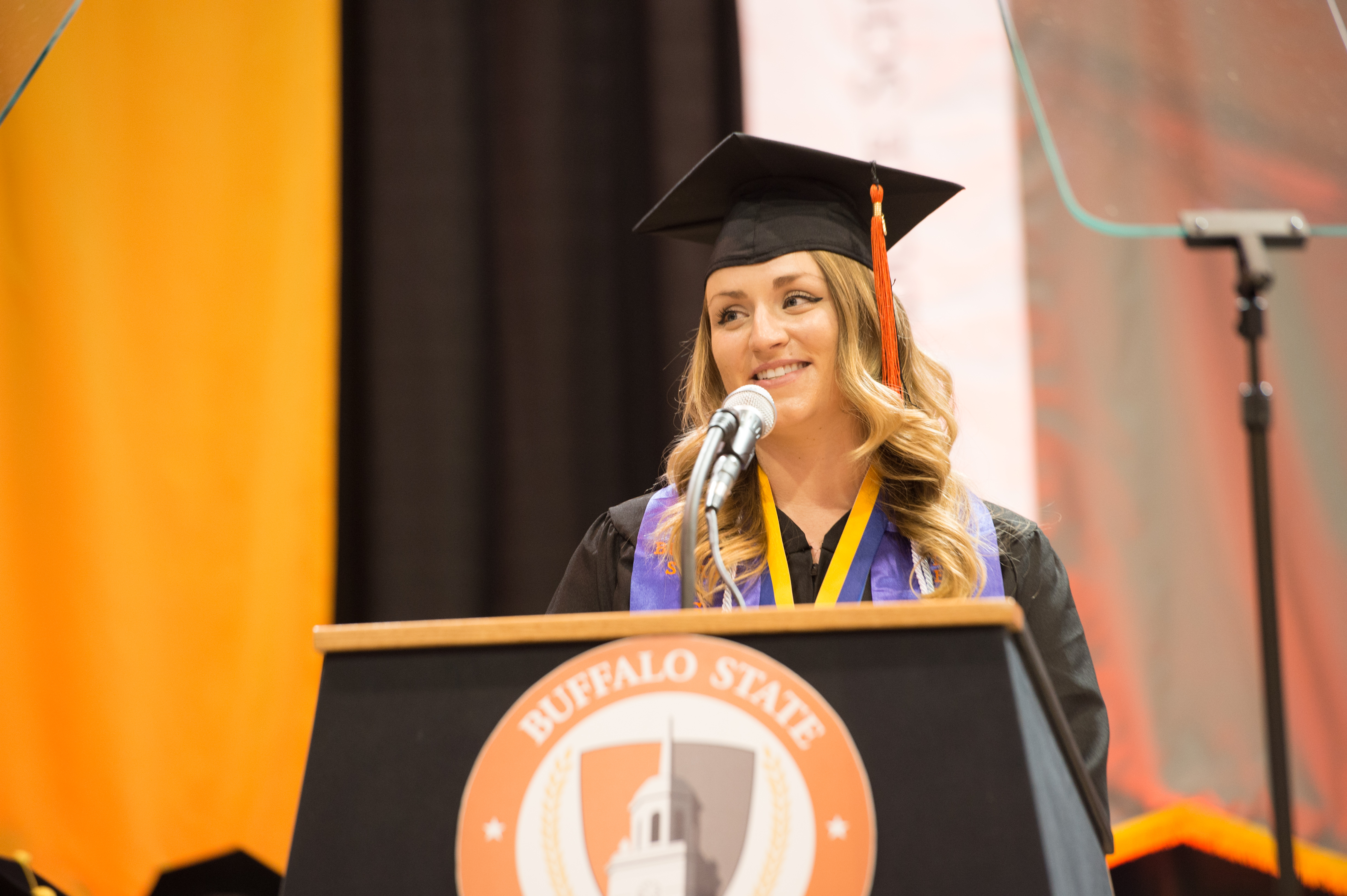 An image of Ashley Weselak speaking at graduation